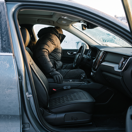 Heated car seat cover fitted on a driver seat